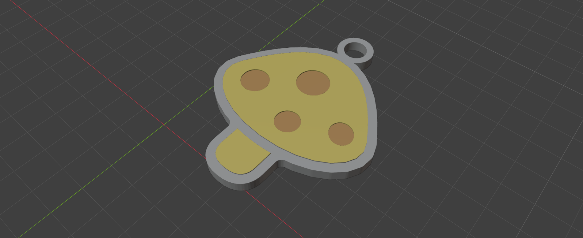 A mushroom-shaped keychain with a welded loop and drilled hole for a keyring