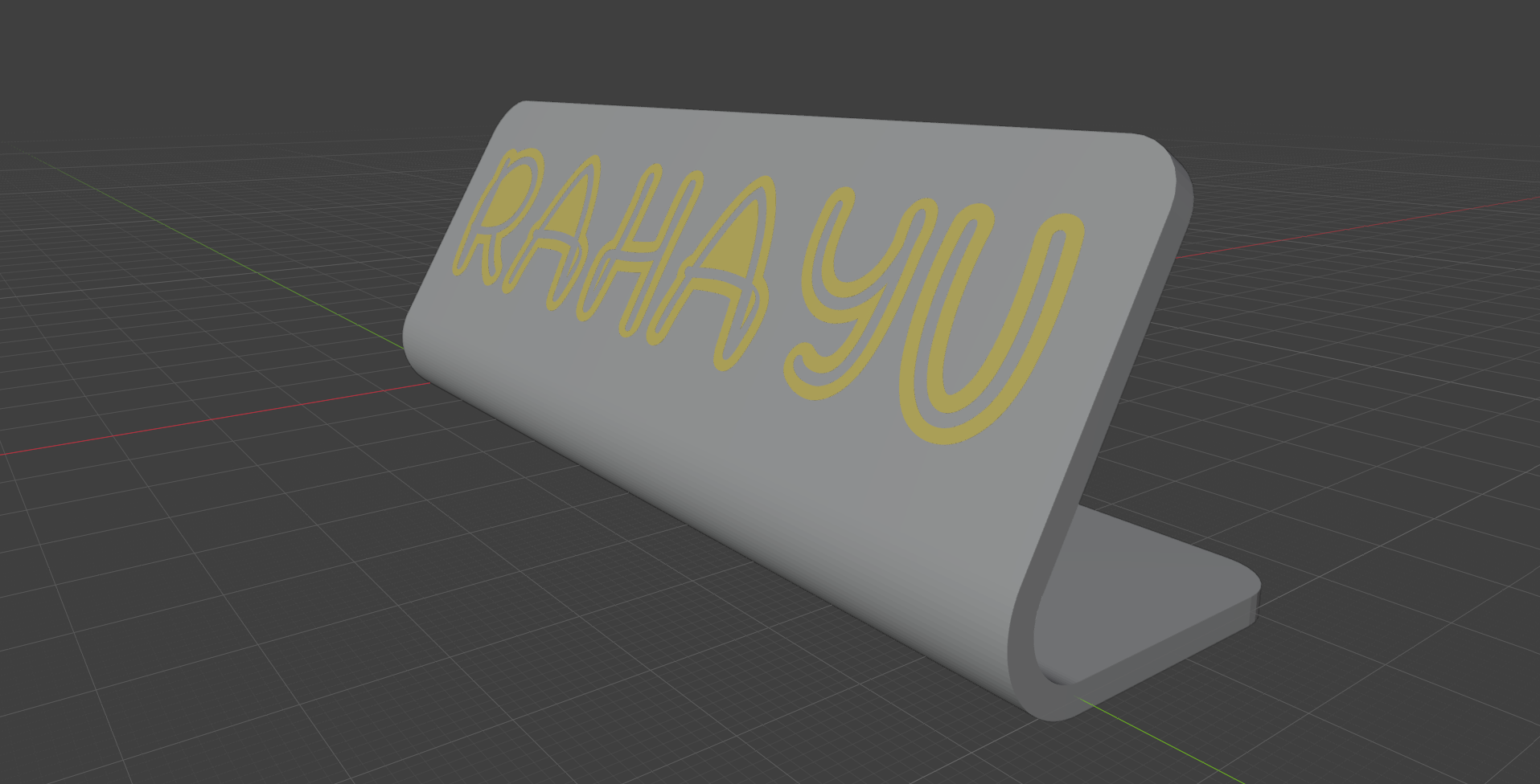 A standing nameplate reading 'RAHAYU', bent into a desk-standing shape
